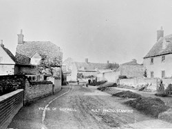 Views of Coxwell - Danes Cottage on the right, the old Post Office on the left, building ahead where Old Walls sits today.