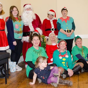 Parish Council staff and Cllrs, in costume, with Father Christmas