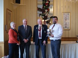 Chris Ball (right) receiving The Mens's Club Championship Trophy from Brian Smith. On the left are 2016 Club Captains Sue & Mike Summersby.