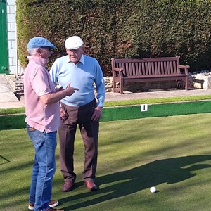 Michael, talking to Bill about the finer points of the game.