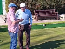 Michael, talking to Bill about the finer points of the game.