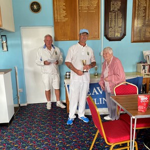 Gary Baines receiving the 2023 Open Pairs Trophy from Jean Williams - his partner Angela Foster was away for the presentation