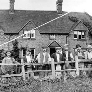 A group of men outside the Red Lion.  Maybe road repairers