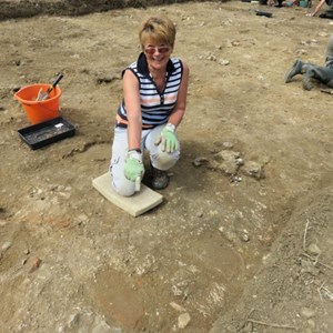 Pam finding  paving in trench 1 in the main villa building.