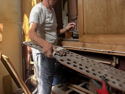 Martin Renshaw at work on the organ, July 2026