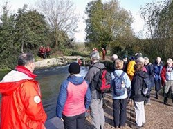 The group stopped to watch Hants Lowland Search & Rescue training in whitewater of the Itchen Navigation – a team member bravely floated in the freezing water as they trained. ©EH