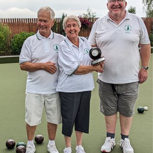 Kay presenting Lionel and Rich with the pairs shield