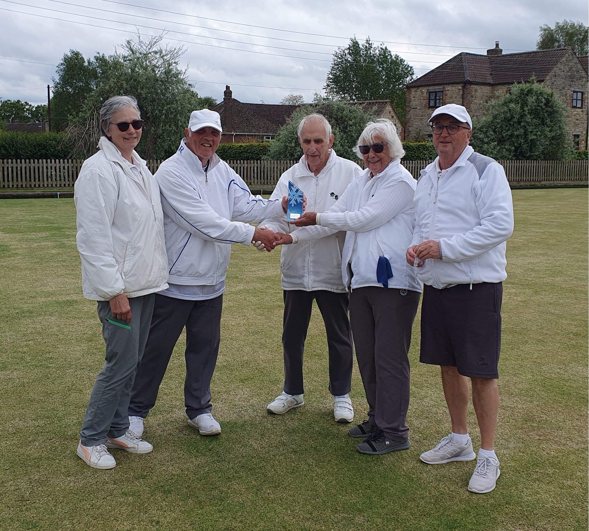 Winners Richard, Annette & Gail receiving trophy from runners up Liz & Bruce.