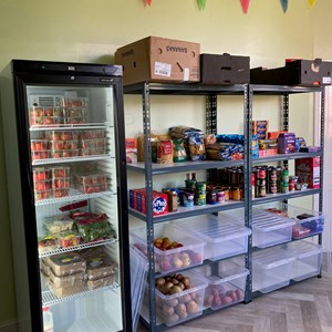 Well stocked fridge and shelves