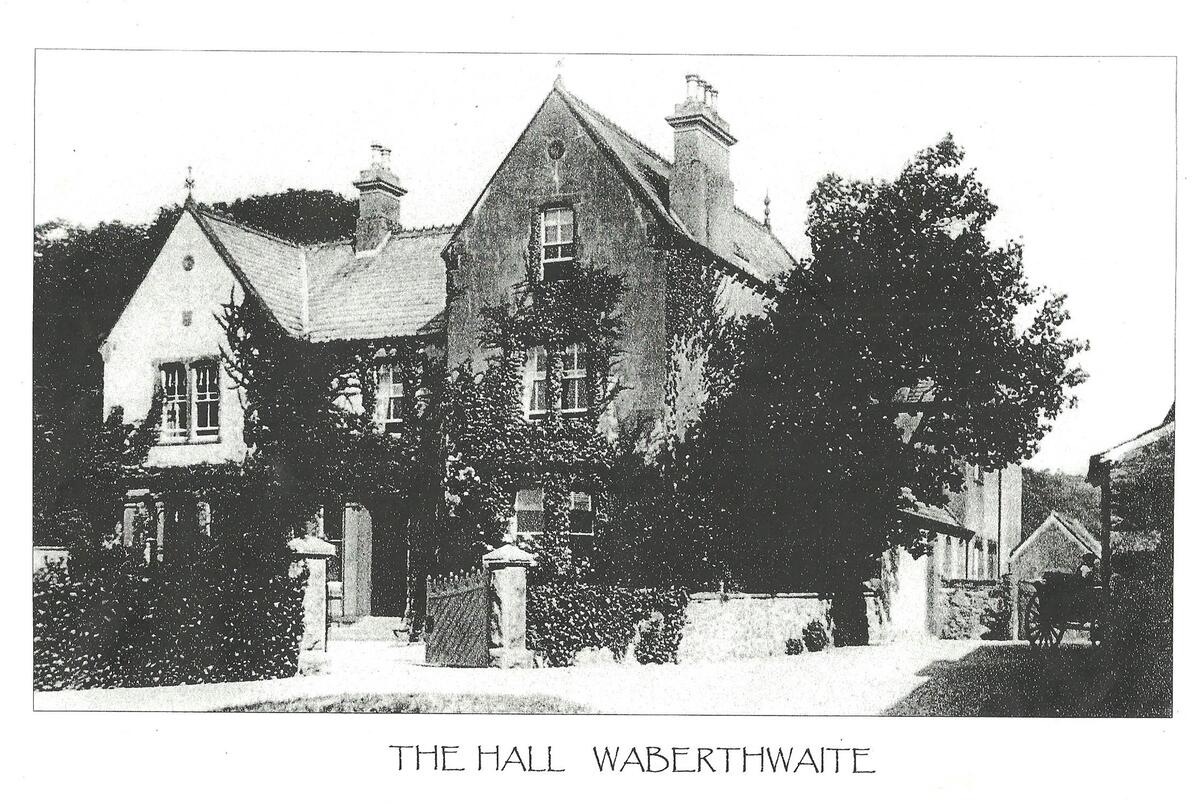 The boundary wall of Waberthwaite Hall with the laundry just visible behind the cart