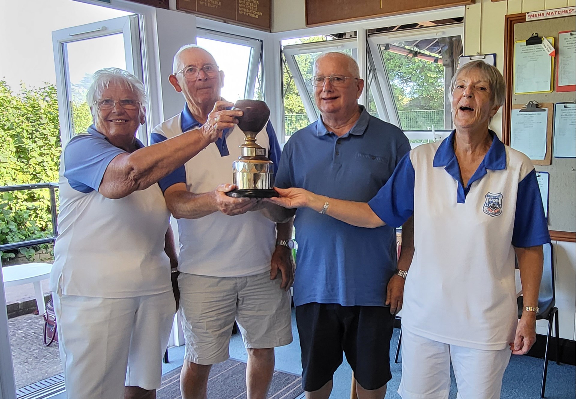 Janet Denyer, Arthur Denyer and April Mitchell  being presented with the Cameron Trophy 2022  by Dave Dyball
