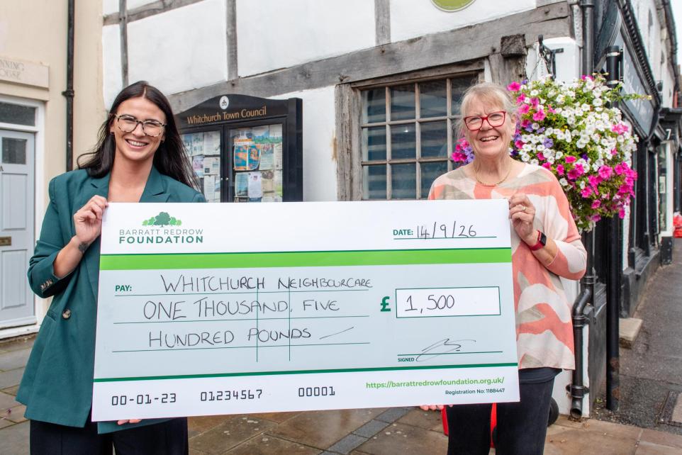 Receiving the donation from Barrett David Wilson Homes