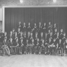 This photograph shows the John Hunt School Orchestra with Norman Pickering, about the year 1960.