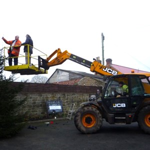 Erecting the Christmas Tree outside the Memorial Hall with help from James Stockdale, Roger Barker, Tony Groves, John Ridsdale, Erkan of the Londesborough Arms and Geoff Milner