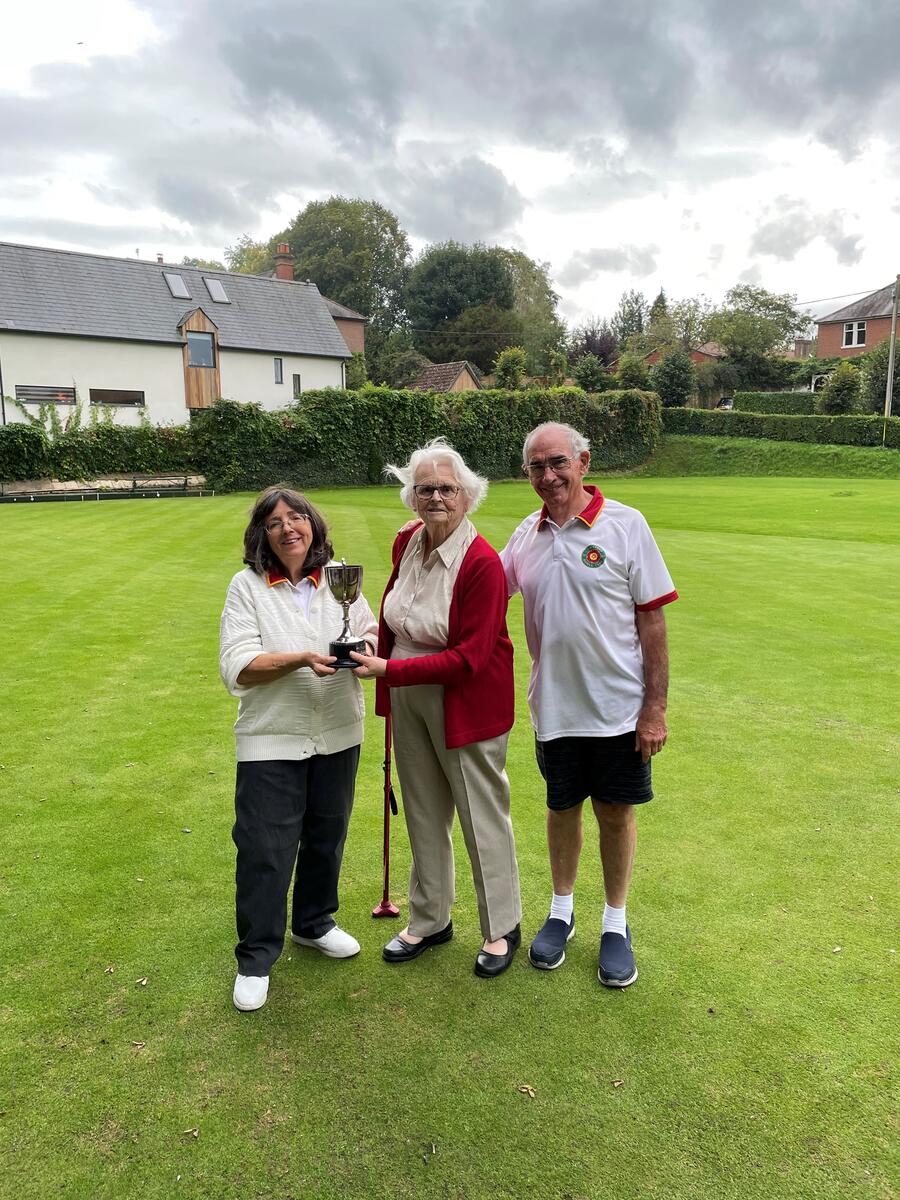 Eva Barber presents The Sam Barber Memorial Cup to Maureen Smith and Dave Chalke