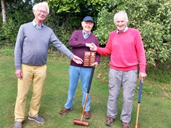 Charles Payne presenting the trophy to winners of the Men's Croquet Final Jeremy Holder & Mick Summerhayes