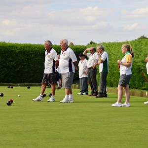Foreground: Dick Ford and Martin Wallace (Ketton) with Hannah Willoughby (Wittering B)