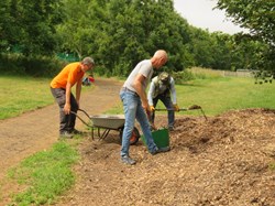 Improving the pathways with wood chip.