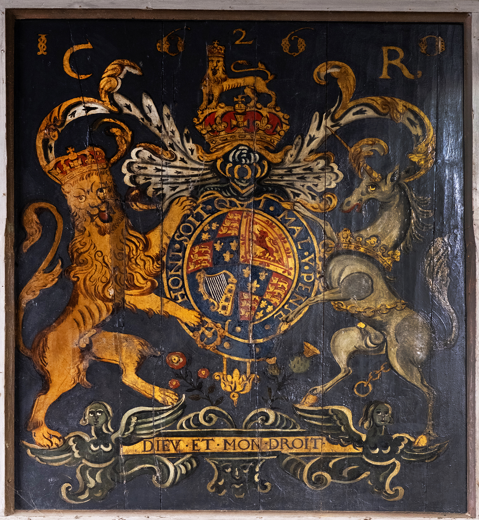 Royal arms of Charles II over the north door
