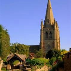 Clive All Saints Church against a blue sky