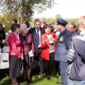 The nieces of Sergeant Harry Oxspring talking with Lieutenant Colonel Doug Moulton of the Canadian airforce