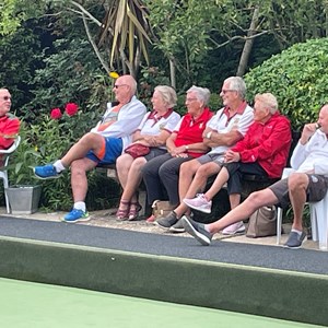 Spectators (mostly) following the play