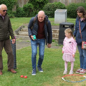 Dad showing daughter how it's done.