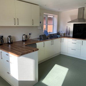 Modern, clean and function kitchen space with three kettles, dishwasher and hob