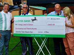 Roy & Elaine Williams accept a cheque for The President's  Charity from Ivan & Alan, all money raised on the day.