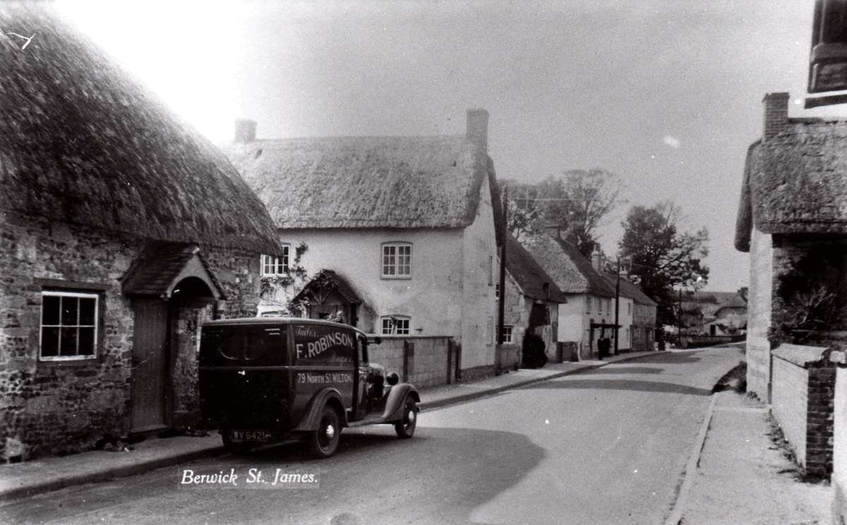 Lodge Cottages is the thatched house on the left