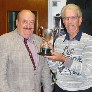 Presentation Evening 2022. Gus Edwards, 3 Woods Winner being presetned with his trphy by County Councillor Ken Crofton