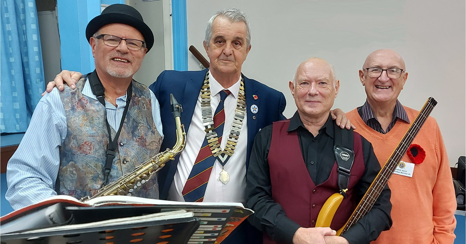 L-R Paul Scott Presenter(Sax), John Pearce Chairman, Phil Evans Presenter (Bass Guitar) & Chris Inch Speaker Finder