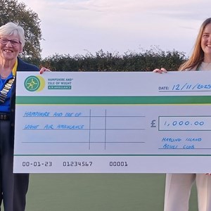 £1000 cheque being presented to Hants & IOW Air Ambulance