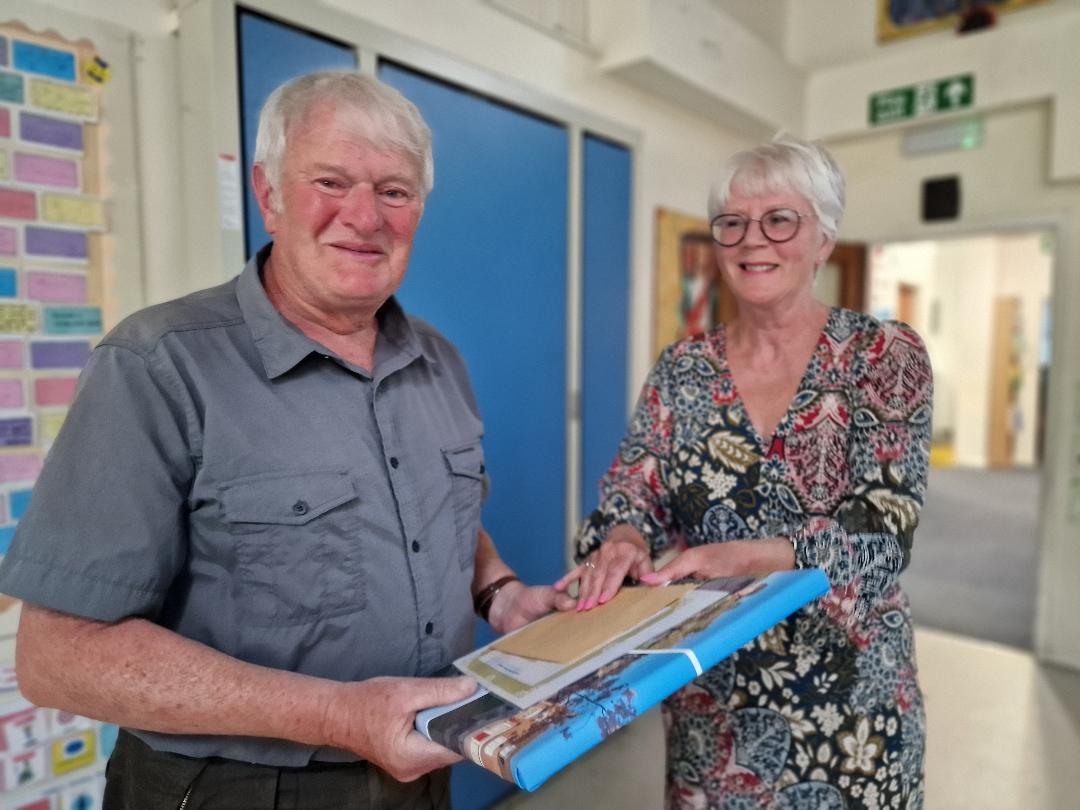 Pete Thornley, receiving his village champion award for 2025 from Cllr Chris Lewington