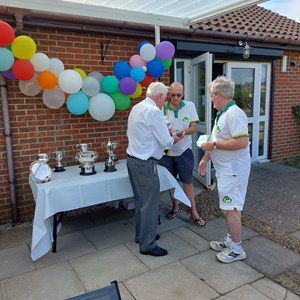 23/ Ian Kirsch receiving his Men's Handicap Trophy from President Ferd Goodege and Competition Secretary Barry Wright