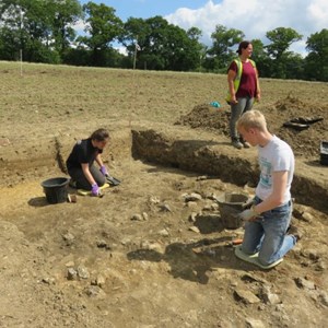 Freya and Geordie cleaning back trench in 2