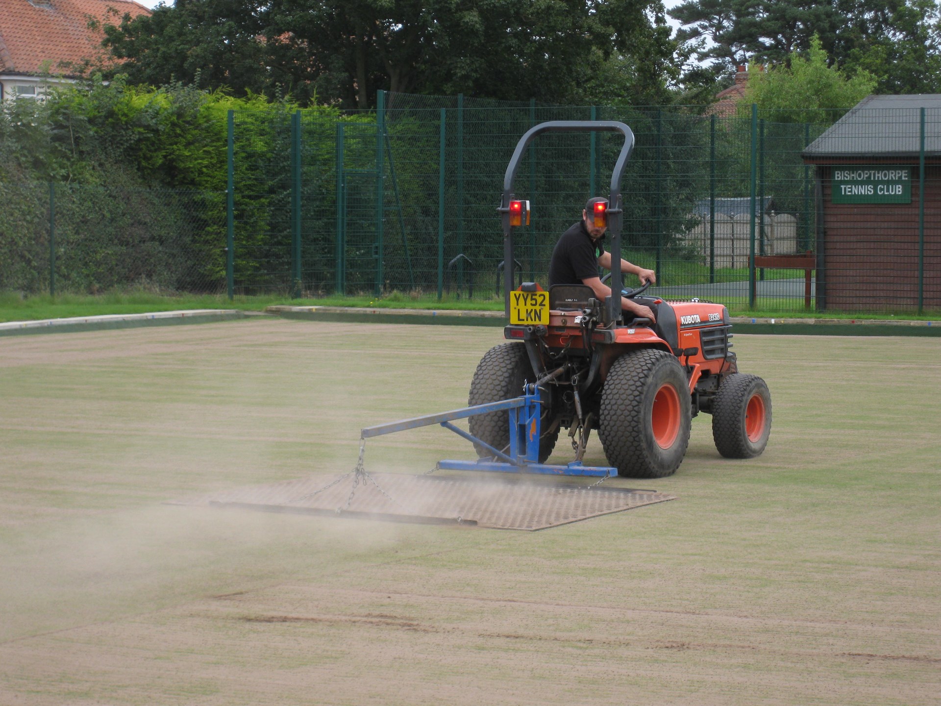 Drag-matting to re-level the surface.