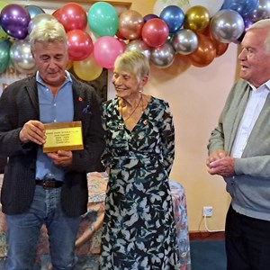 Paul Ugo with his plaque for his Shirt Sponsorship, presented by Brenda Barber and President Fred Goodege