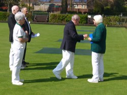 Ladies Captain Janet collects her badge