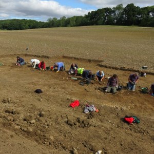 Volunteers start clearing the loose from trench 4 – the smaller of the two buildings – all of which has been opened up by the digger.