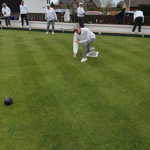 President Liz Dyer sending down first ceremonial wood of the season