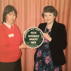 Sally Warner and Ros Blackman showing off the award Oakley won in the Hampshire Best Kept Village Competition in 1989