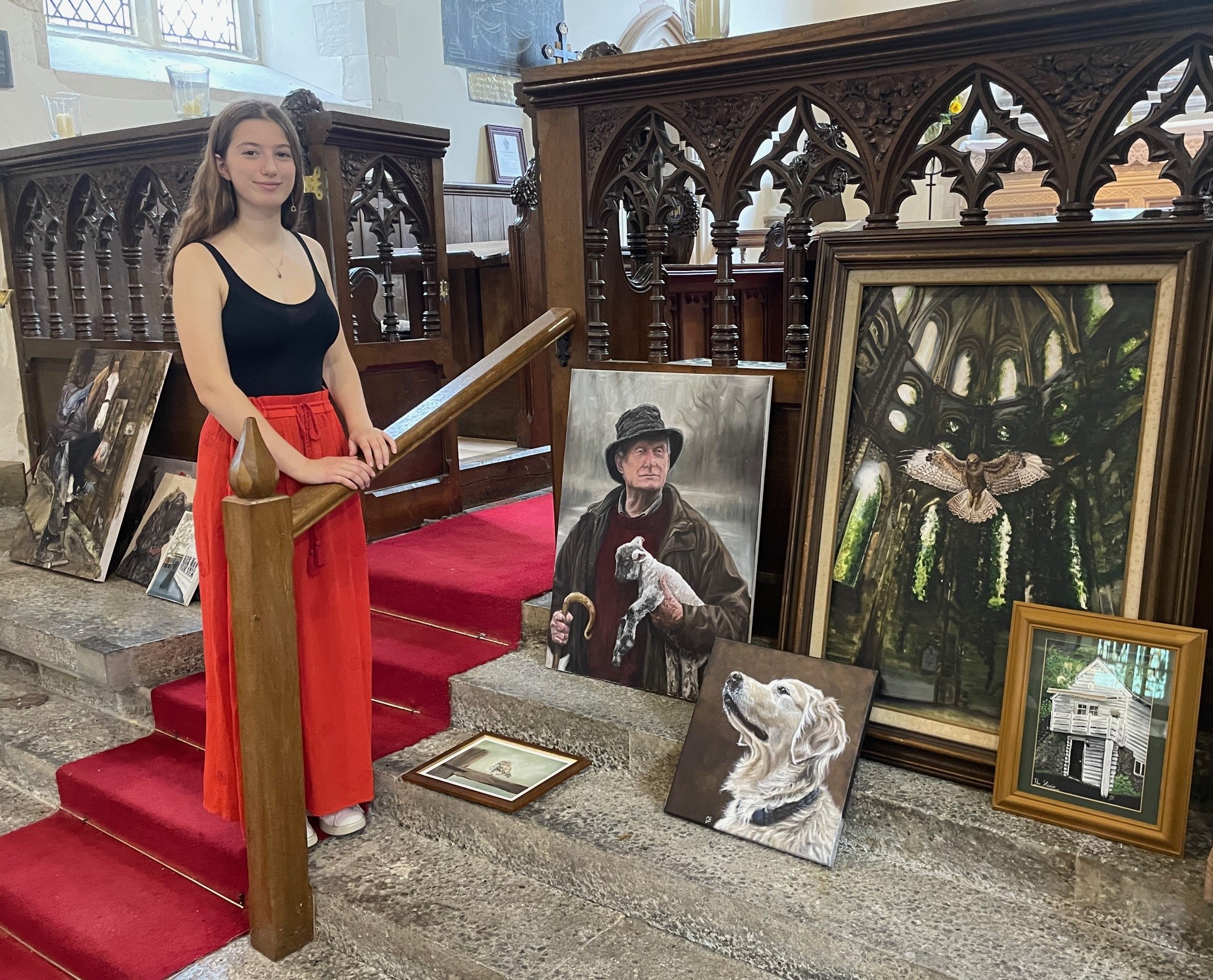 Very talented local artist, Lily Goodwin, with some of her work in Boughton Malherbe Church at a recent Cream Tea afternoon Picture courtesy of John Collins
