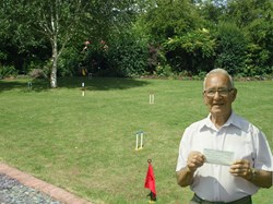 Steve with the cheque from the John Ross Foundation, which was used to purchase the Croquet equipment