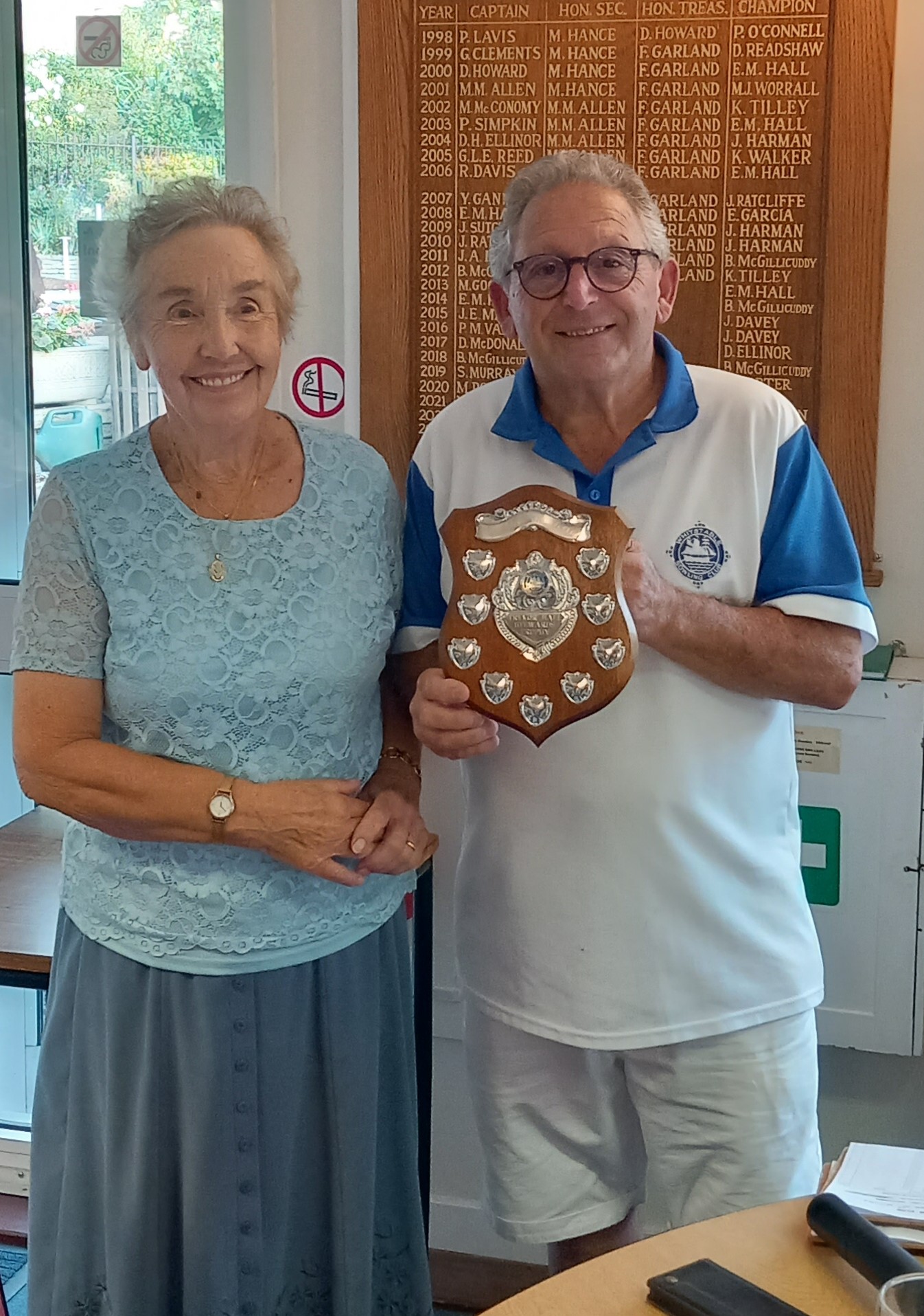 Edna Hall presenting Mike Amura with the Trevor Hall Stewards Trophy