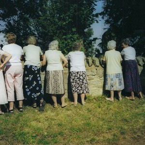 Waiting toi saee the bride emerge from the church