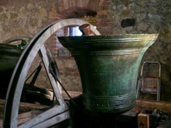 One of the bells hanging beside its wheel