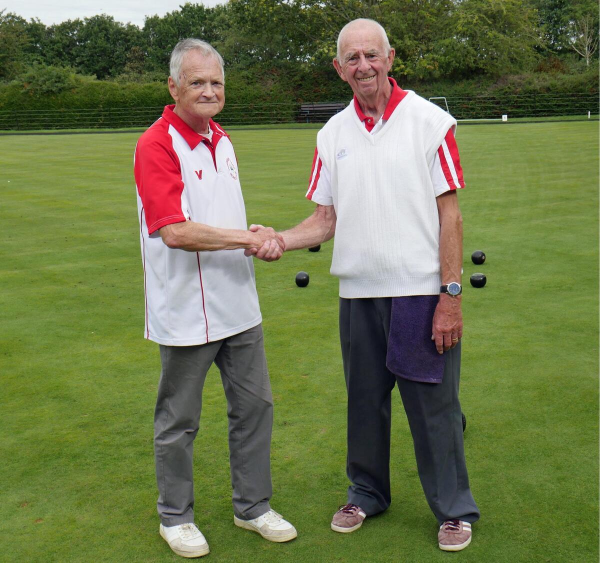 Robin (left) congratulates his opponent Adrian on winning the Open Singles H'Cap . Chris was the Marker.