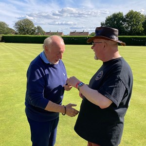 DEnnis Lester receives the Spoon award from Alex Donovan