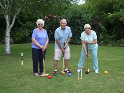 Marie, Steve and Sandie try out the new Croquet Lawn